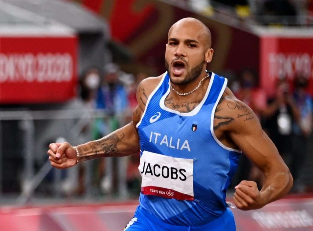 Marcell Jacobs exults after winning the men's 100m at the Tokyo Olympics.