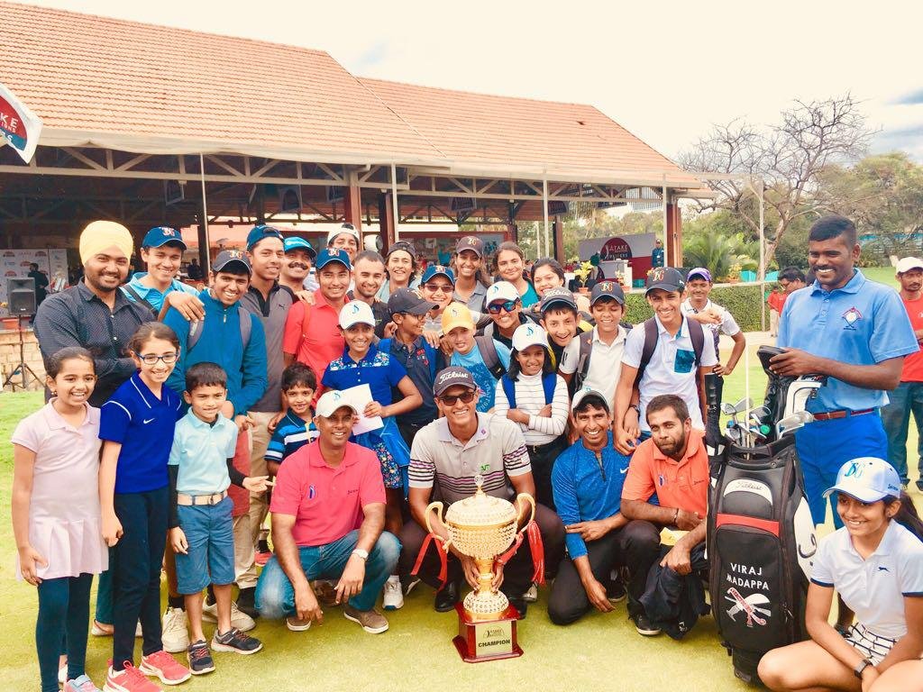 An elated Viraj surrounded by a group of excited children at the Karnataka Golf Association after the win.