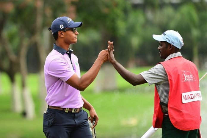 Viraj Madappa celebrates with his caddie after breaking through on the Asian Tour with the win at the 2018 Take Solutions Masters in Bangalore.