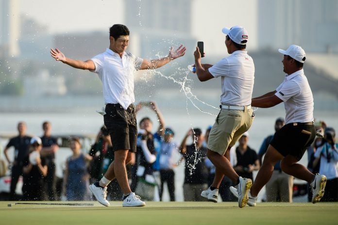 Japan's Keita Nakajima is doused by teammates after winning the Asia-Pacific Amateur Championship in Dubai on Saturday. Photo: AAC